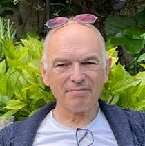 A person with sunglasses on his head

Description automatically generated